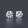 Close-up of sparkling round-cut cubic zirconia stud earrings in a four-prong silver setting - 4-Prong 4mm / Silver