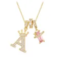 Close-up detail of a gold-plated pendant featuring pave letter A crown and pink zirconia - Gold A (Pendant + Box Chain)