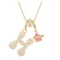 Golden necklace with iced-out letter H pendant and pink planet crystal charm detail - Letter H
