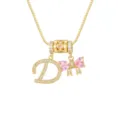 Macro view of 18k gold plated necklace with zircon-encrusted letter D and pink bow - Letter D / Pendant + Box Chain / Gold