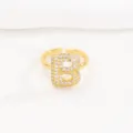 Detailed macro view of a gold pavé crystal bubble letter B adjustable open ring for women - Letter B Style