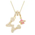 Detailed close-up of gold necklace with butterfly and pink planet zircon pendants - Letter W
