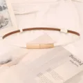 Detail of white genuine leather thin belt with elegant gold metallic buckle for dresses - White