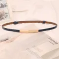 Detail of a slim blue leather belt with an adjustable gold buckle for dresses. - Black
