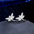Close-up detail of silver dragonfly stud earrings with micro-pave cubic zirconia stones - Dragonfly Design (NO.7)