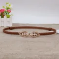 Slim brown leather waist belt for women, featuring a stylish gold leaf pearl snap buckle. - Caramel color