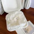 Elegant white orchid flower hair clip with pearl center presented in a white gift box - Milk White