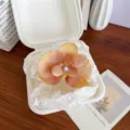 Elegant terracotta orchid flower hair clip with pearl center in a fairy style aesthetic - Orange