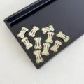 Mini horquillas en forma de hueso color crema con lunares de colores para niños y mascotas - Albaricoque Lunares