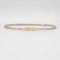 Slim adjustable women's belt, metallic gold finish with pearl rhinestone decorative buckle. - Gold