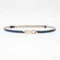 Navy blue thin leather belt featuring pearl rhinestone flower buckle for elegant dresses. - Blue