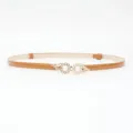 Brown patent leather dress belt with elegant pearl flower metal buckle, adjustable size. - Camel
