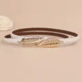 Cintura sottile in pelle bianca da donna con fibbia dorata a foglia accessorio moda elegante - Bianco
