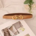 Brown patent leather women belt with metal buckle, elegant slim accessory for dresses. - Glossy Apricot
