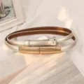 Champagne gold adjustable skinny leather belt with minimalist metallic buckle for dresses - Gold