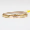 Gold thin belt for women, minimalist waist chain, sleek metal buckle, stylish leather accessory. - Gold