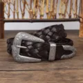 Close-up of vintage braided dark brown leather belt with ornate engraved silver metal buckle - 110cm / Coffee