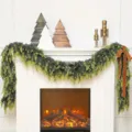 Lush faux Norfolk pine garland draped over a cozy white mantel with a warm fireplace display. - 2.7m (238 Tips)