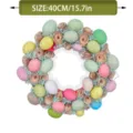 Detailed view of 40cm/15.7in Easter egg wreath with wood silk flowers for home decor - 40x40x10cm / Colorful Easter Egg Wreath