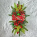 Detailed view of festive Christmas stair swag with red plaid bow and berries - Bowknot Style / Without Lights