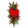 Elegant Christmas teardrop swag featuring a large red bow, pine cones and berries - Scale Pine Swag / Without Lights