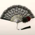 Gothic lace folding fan with gold ribs, black and red roses, and elegant tassel for party. - Double Rose Gothic Fan with Pendant