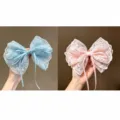 Detail view of handmade lace hair bow with long ribbons, fairy style hair accessory. - Ice Blue & Sakura Pink