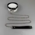 Detailed view of punk style black PU leather choker collar with metal bell and long chain leash. - Choker and Leash Set / Black Combo: Flat Bell Collar and Leash