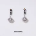 Adjustable metal bell clip-on body jewelry with hollow floral pattern and black elastic band. - Silver Figure-8 Clip with Palace Bell