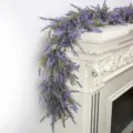 Detailed view of an artificial purple lavender garland draped over a white fireplace mantel - Lavender Garland (Boxed Pack)