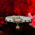 White leather choker collar with gold horsebit hardware and delicate bell pendant. - Palace Bell + Chain + Gift Box / White