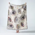 Detailed view of bohemian woven throw blanket with colorful evil eye patterns and fringe - Evil Eye Style (XT07-12) / 130x160cm