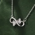 Detailed close-up of Korean minimalist infinity 8-shape butterfly zircon necklace and fine chain. - X5880-2 Style