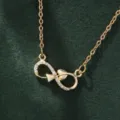 Elegant gold infinity symbol necklace featuring sparkling cubic zirconia stones and delicate chain. - X5882-1 Style