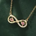 Close-up detail of a minimalist gold infinity symbol pendant necklace with sparkling zircons. - X5881-1 Style