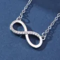 Exquisite detail shot of the silver infinity symbol pendant necklace with sparkling micro-set zircons. - X5883-2 Style
