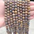 Close-up of matte natural yellow tiger eye round beads for handmade DIY jewelry - 4mm / 90 Pieces/Pack / 1A Natural Matte Yellow Tiger Eye