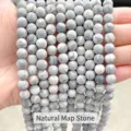 Macro view of matte natural map stone round beads with unique grey marbled textures - 8mm / 47 Pieces/Strand / Natural Frosted Map Stone