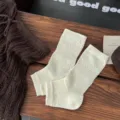 Women retro hollow knit leg warmers spring breathable stirrup slouchy socks pair. - One Size / Milk White