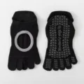 Black five-toe yoga socks with anti-slip silicone grips for pilates and fitness training. - One Size / Black