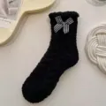 Cozy black fuzzy coral fleece mid-tube socks with cute black white checkered bow for winter. - Black Bow