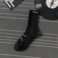 Detailed view of men's black athletic mid-calf socks with breathable knit and cushion sole. - One Size / Over-the-knee / Black
