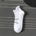 White athletic ankle socks for men, featuring a cushioned towel bottom and breathable knit. - One Size / Quarter / White