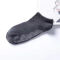 Gray non-slip yoga socks detail view with dotted silicone soles for grip and sports activities. - One Size / Iron Gray