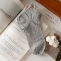 Grey ribbed short socks for women with cute pink embroidered bow, sweet spring summer style. - One Size / Light Gray