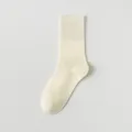 Women solid color crew socks in off-white, comfortable cotton knit for daily wear. - One Size / Creamy White
