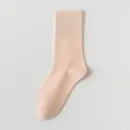 Solid color women's mid-calf cotton socks in soft apricot, comfortable breathable daily wear variant - One Size / Orange
