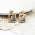 Close-up of colorful crystal perfume bottle pendants in 18K gold plating - Colored Zirconia Perfume Bottle Style (A0103)