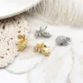 Close-up of 18K gold and silver plated pinecone shaped charms for DIY jewelry making - Gold Coin Pomegranate / 12x17mm