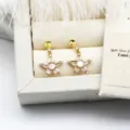 Detailed view of star-shaped DIY earring mountings with zirconia and white shell - Zirconia Star Pair / 14.7*24mm